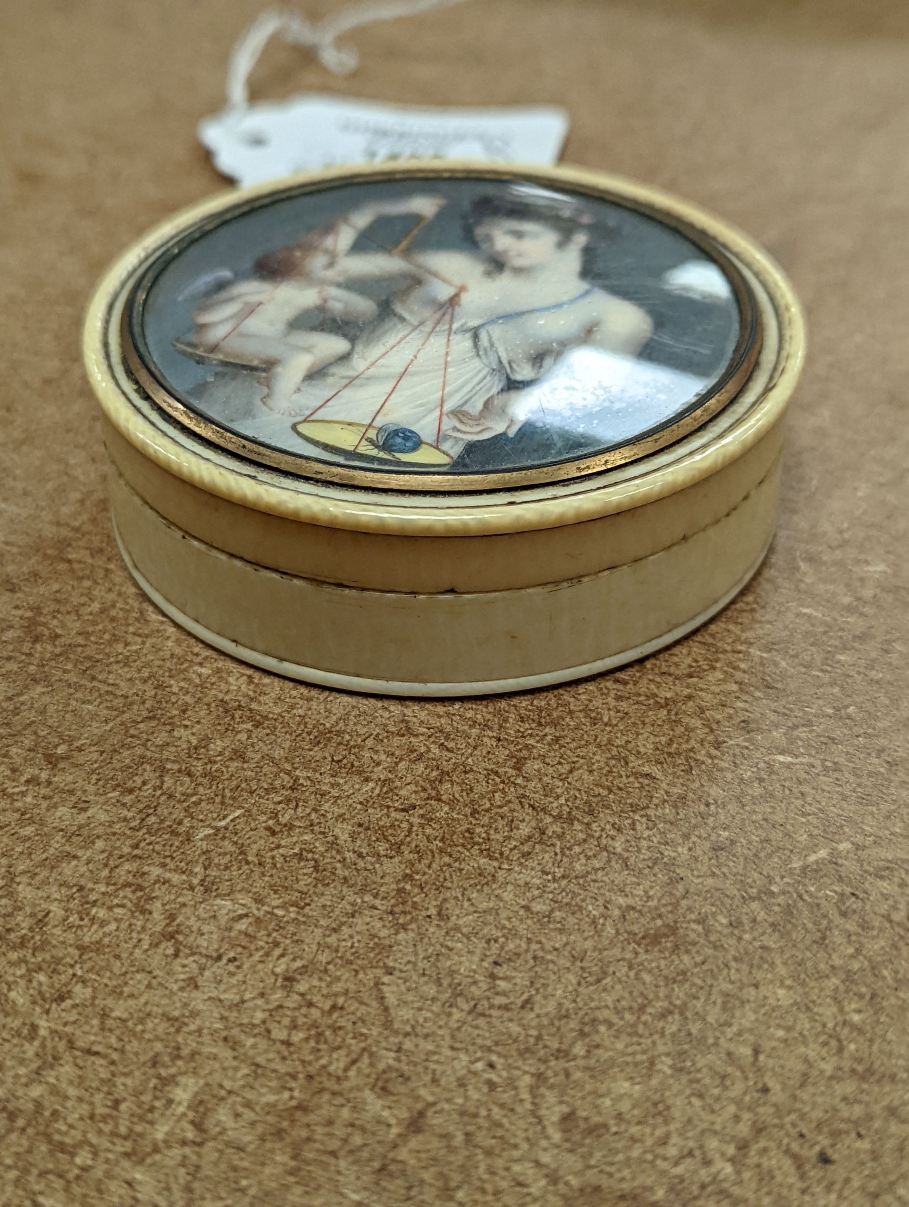 An early 19th century ivory and tortoishell box with inset miniature of Themis to cover, 8cm.